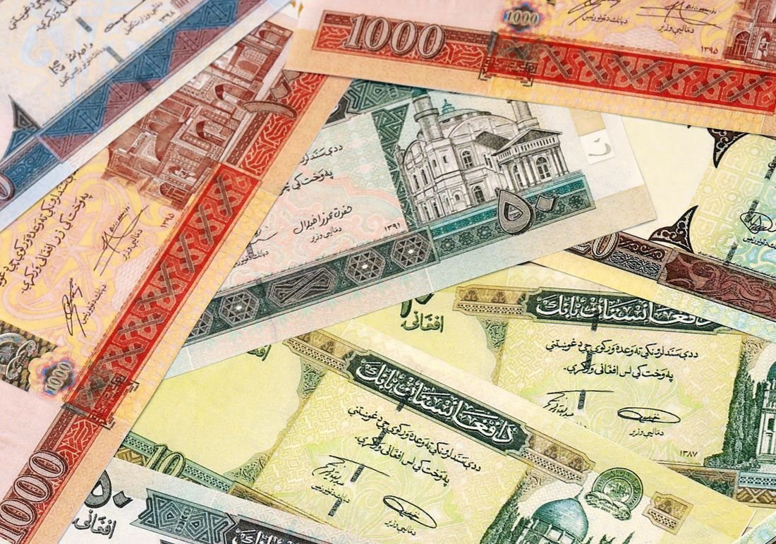 Afghan afghani banknotes showing traditional architecture and script